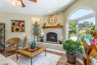 Kevin laid the ceramic tile flooring, tiled the front of the fireplace, and distressed the mantel.