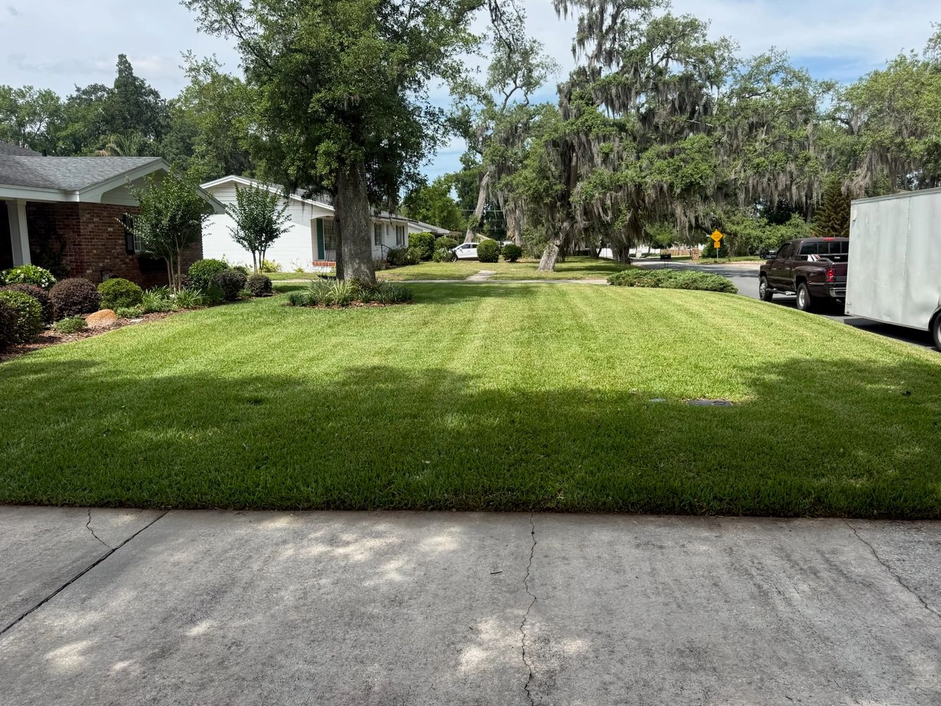 Neatly mowed residential lawn maintained by Murphy’s Ranch LLC
