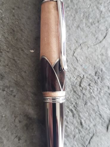 Segmented pen with macassar ebony and aluminum accents