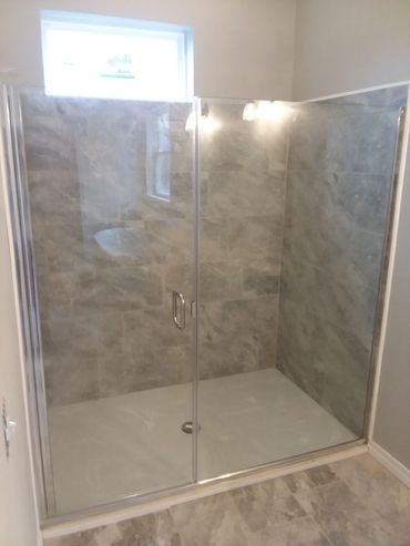Shower door with inline panel