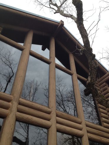 Trapezoid glass in log home