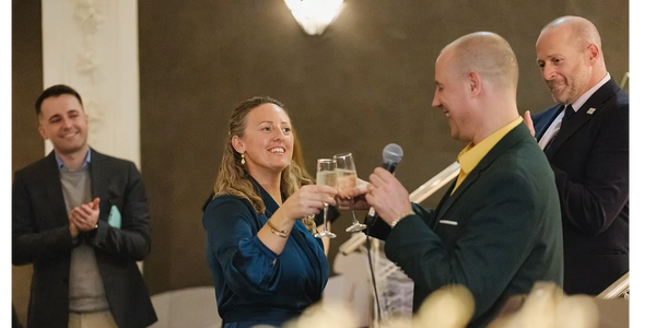 Craig and Jodie Clinking Champagne glasses at Crodie Files first event