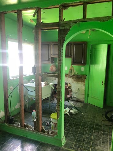 Kitchen before wall demo, cabinet installation and painting.