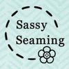 Logo with 'Sassy Seaming' text and a flower on a light blue background.