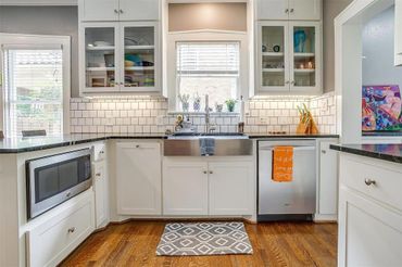 Custom kitchen remodel. Custom cabinetry, subway tile, Carrera marble tops, hardwood floors