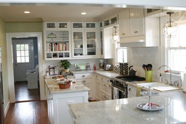 Custom kitchen remodel. Custom cabinetry, subway tile, Carrera marble tops, hardwood floors