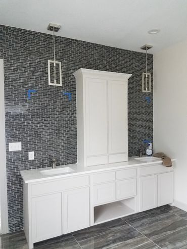 Contemporary bathroom with mosaic tile accent wall. Large scale tile floor