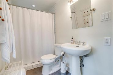Vintage bathroom with walk-in shower and pedestal sink