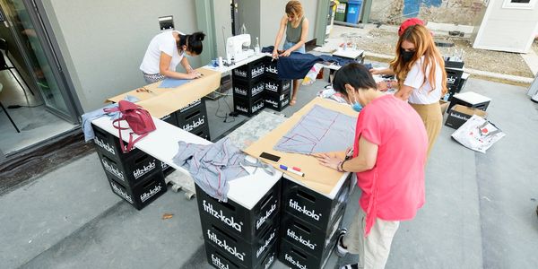 seamstresses tracing recycled materials