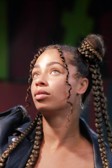 Portrait of young woman with braids