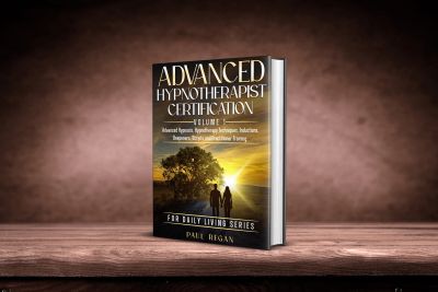 Book titled Advanced Hypnotherapist Certification standing on a wooden surface.