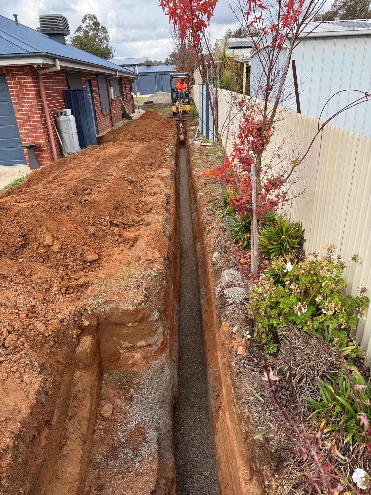 Licensed plumber digging sewer line