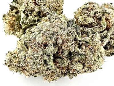 Close-up of dense cannabis buds with frosty trichomes and orange hairs.