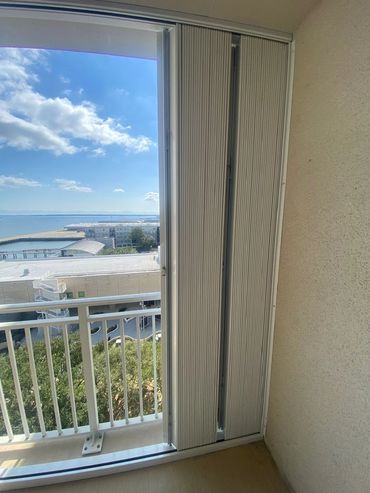 easy to close condo shutters, condo building protection, Accordion condo shutters Myrtle Beach
