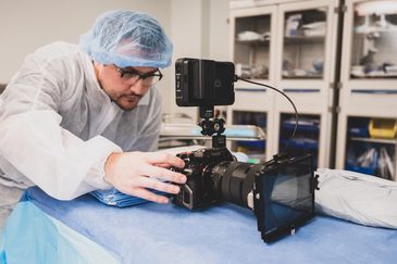 Brandon "Waffle" Bordelon of Video Aces Video filming in an operating room
