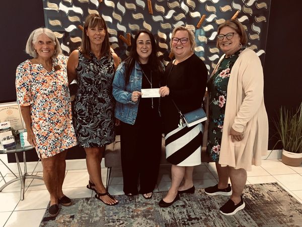 Ladies awarding grant to ladies.