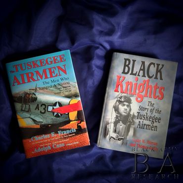 Signed copies of Tuskegee Airmen and Black Knights books autographed by original WWII pilots.