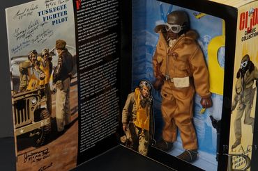 GI Joe Tuskegee Airmen fighter pilot figure box autographed by seven original WWII pilots.
