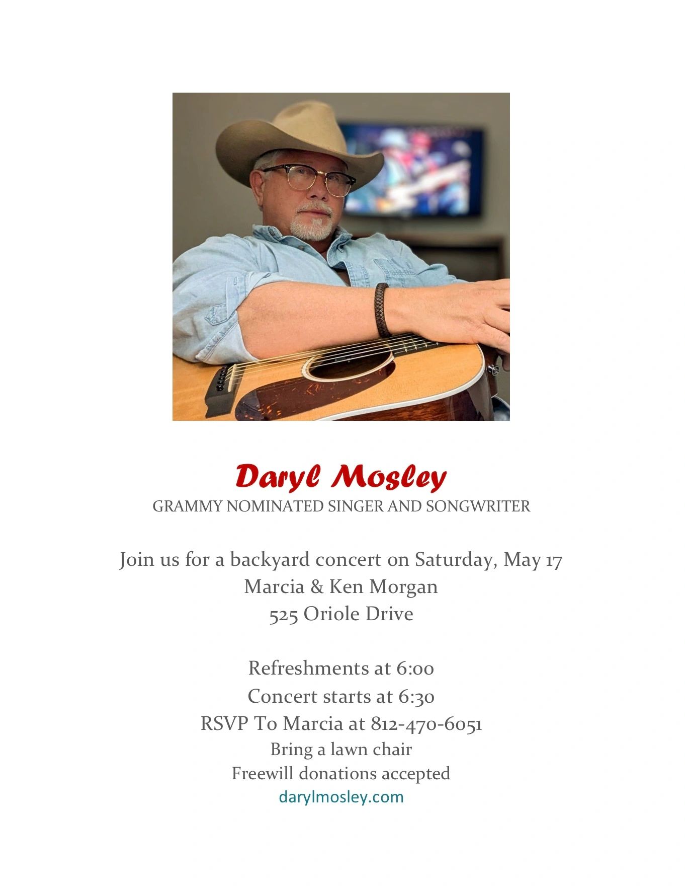 Daryl Mosley, Grammy-nominated singer, holding a guitar and wearing a cowboy hat.