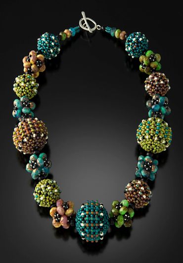 Necklace of handwoven and layered glass beads