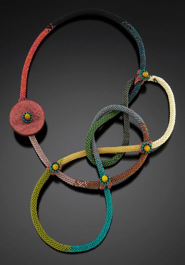 Handwoven glass beaded tube necklace. Inspired by boy scout knotting.