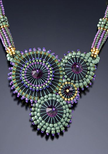 Necklace of handwoven and layered glass beads. Swarovsky crystals.