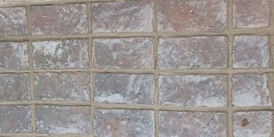 Square stone tiles wall.