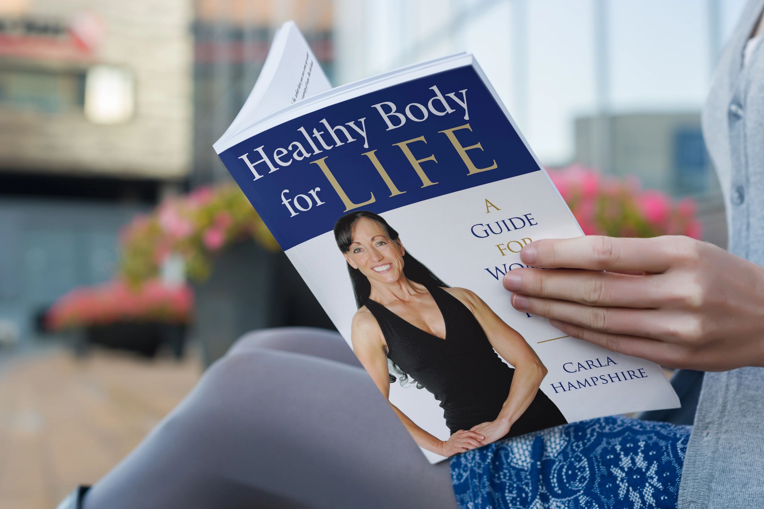 woman holding a health book for women over 40