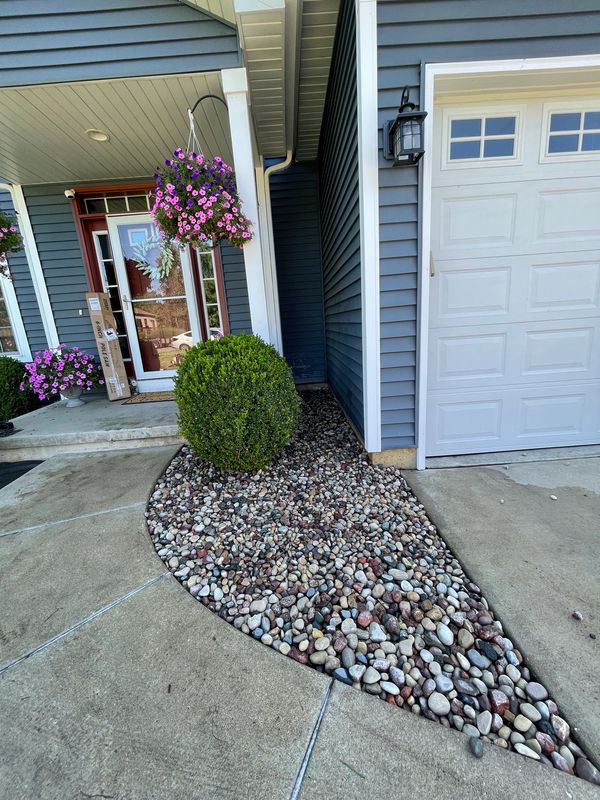 A house with a front yard and a driveway