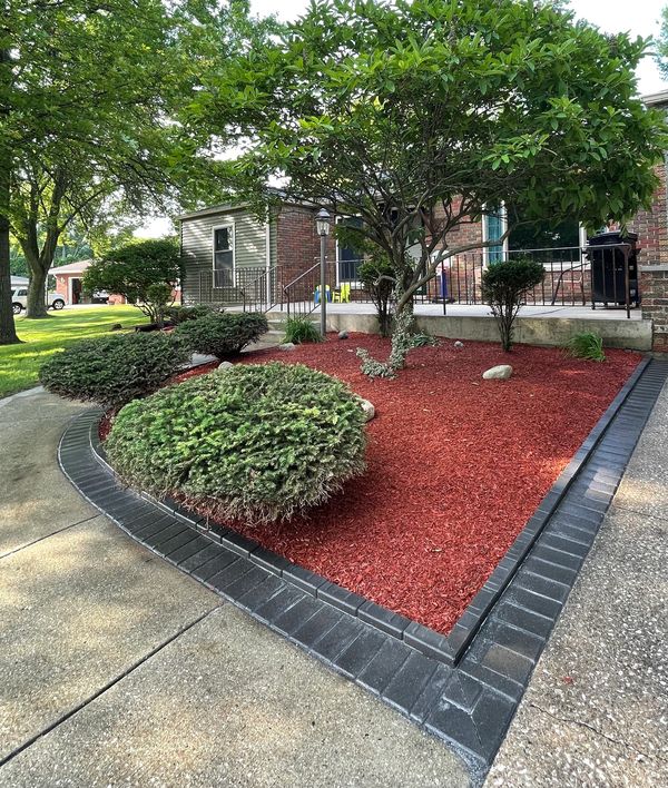 A red mulch garden in a residential area