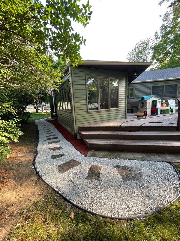 A house with a deck and steps leading to it
