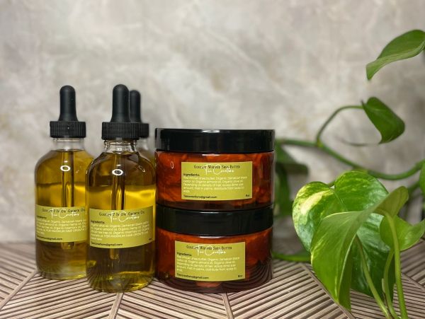 Bottles and jars of skincare products with a green plant.