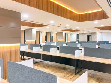 Corporate office interior design in Dubai with wood ergonomic furniture and modern workspace