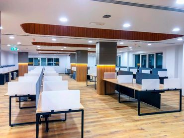 Corporate office interior design in Dubai with wood ergonomic furniture and office tables