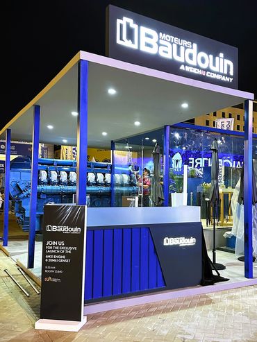 Outdoor exhibition stand in Dubai for Baudouin – bold design showcasing large industrial machines.