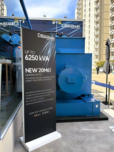 Outdoor exhibition stand in Dubai for Baudouin – bold design showcasing large industrial machines.