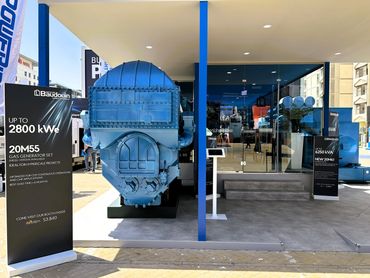 Outdoor exhibition stand in Dubai for Baudouin – bold design showcasing large industrial machines.