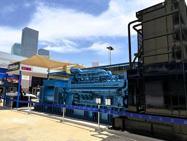 Outdoor exhibition stand in Dubai for Baudouin – bold design showcasing large industrial machines.