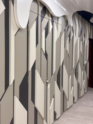 Corporate office interior design in Dubai with modern and unique wall design.