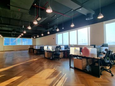 Modern office renovation with bespoke joinery, glass partitions, and functional workspace design.