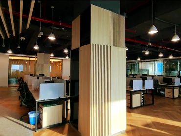 Modern office renovation with bespoke joinery, glass partitions, and functional workspace design.