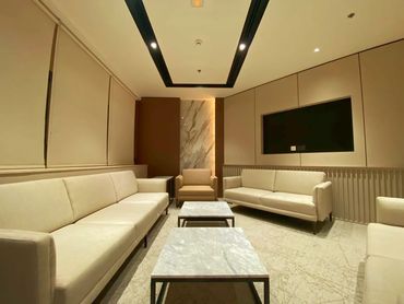 Corporate office interior design in Dubai with ergonomic furniture and close meeting room.