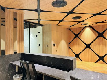 Corporate office interior design in Dubai with modern reception and ceiling