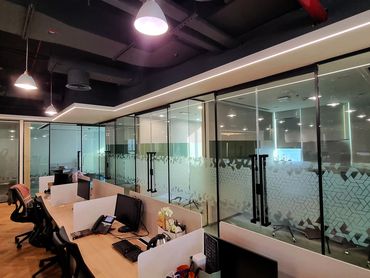Modern office renovation with bespoke joinery, glass partitions, and functional workspace design.