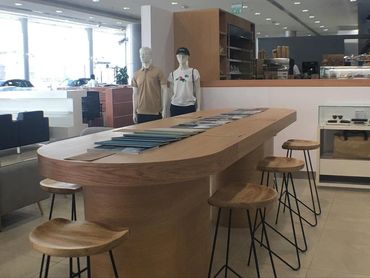 Wood-accented F&B interior in Dubai for Healthy Farm Eatery – warm, natural, and inviting design.