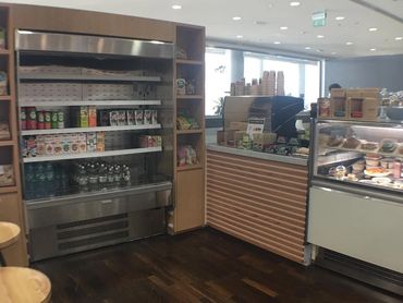 Wood-accented F&B interior in Dubai for Healthy Farm Eatery – warm, natural, and inviting design.