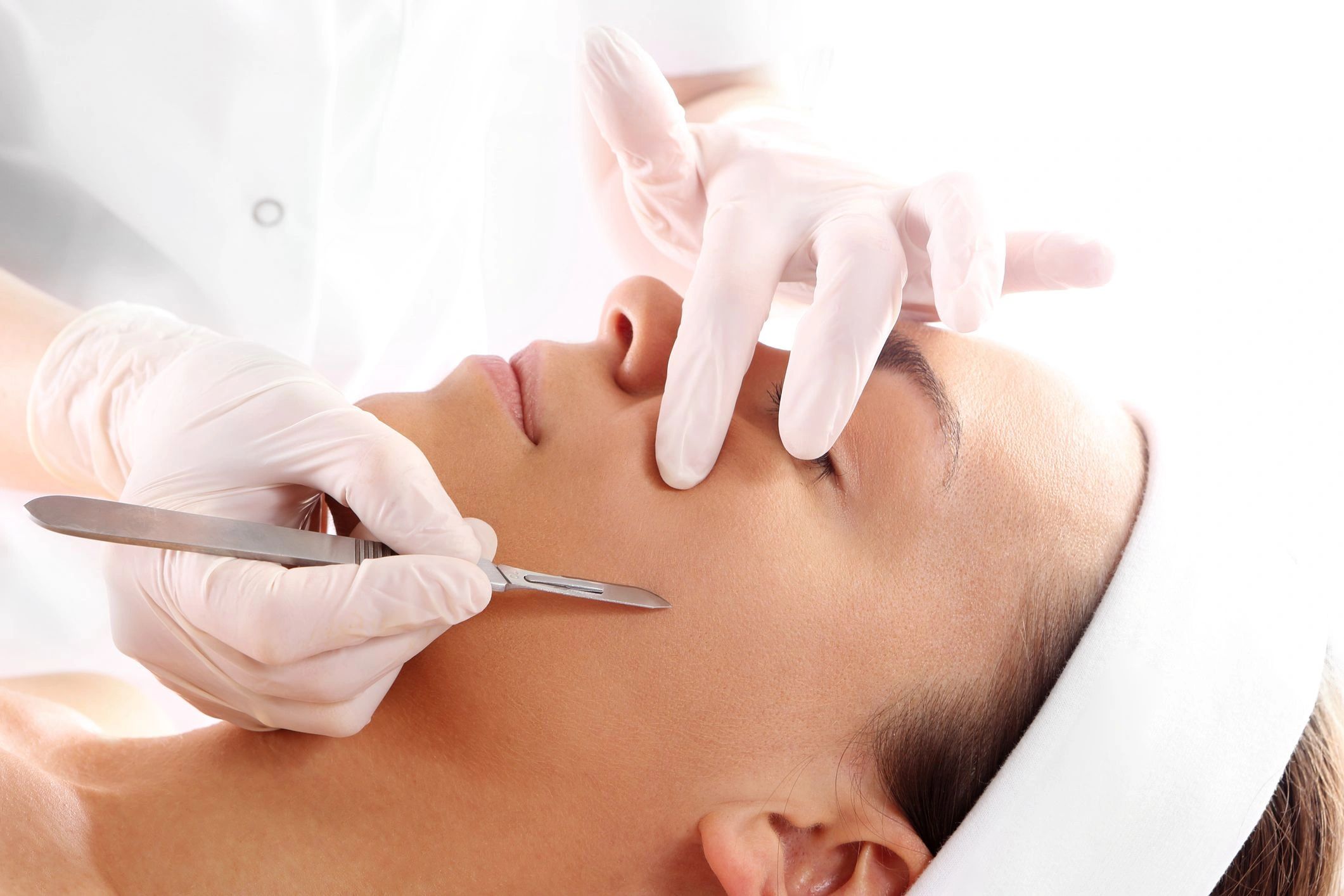 Woman receiving a medical facial.