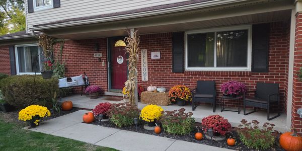 Fall Decoration package in Plymouth, MI. Mums and Pumpkin install. Lawn maintenance. Holiday fun.