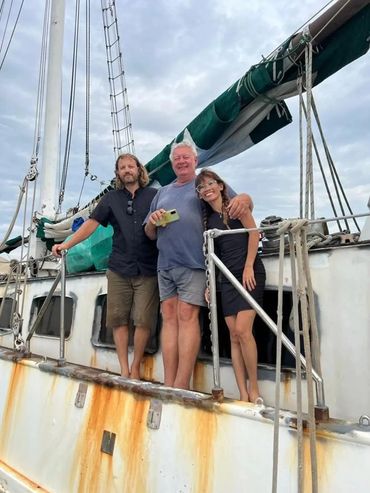 Crew of 97-foot Dutch Ketch Zeepaard, Paul Brown (Chief Engineer), Ray Thackeray (Captain) and Daisy