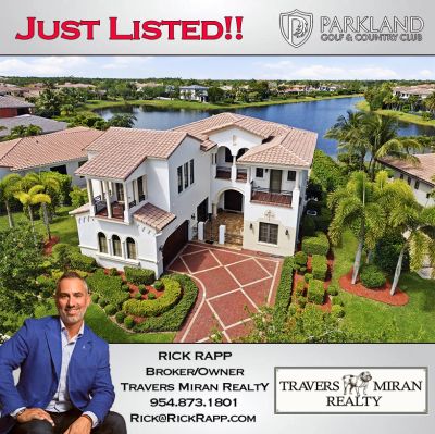Luxury home listed at Parkland Golf & Country Club with lake views and elegant landscaping.